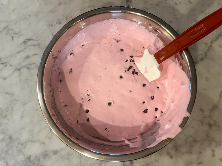 Marshmallow fluff in a bowl with a spatula