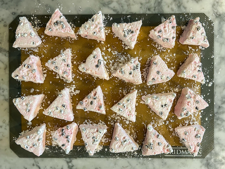 Triangle shaped watermelon marshmallows on a silicone mat