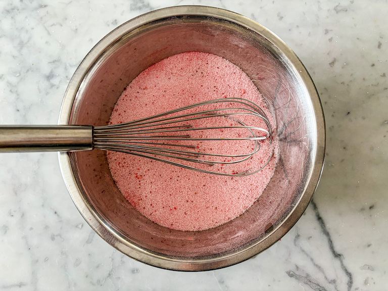 Strawberry sugar in a bowl with a whisk