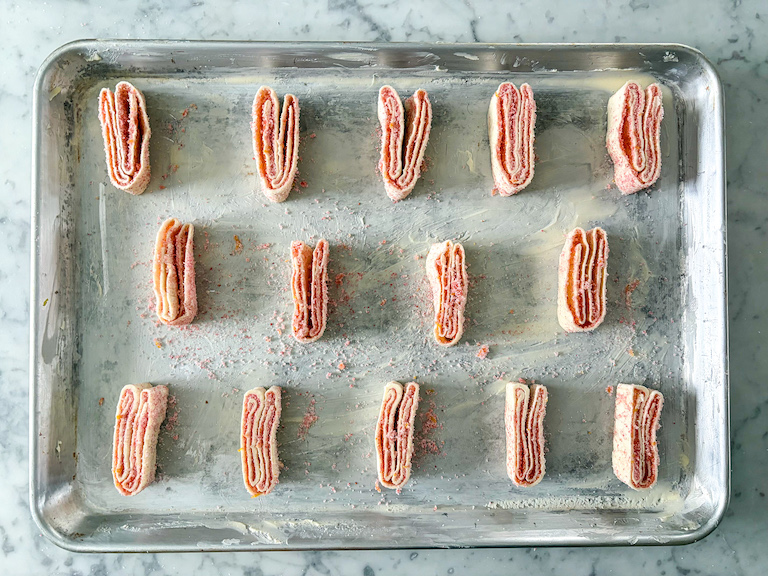 Strawberry palmiers on a tray before baking