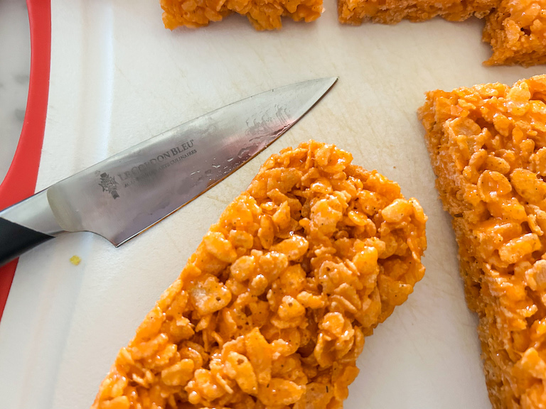 paring knife trimming creamsicle krispie treat pops