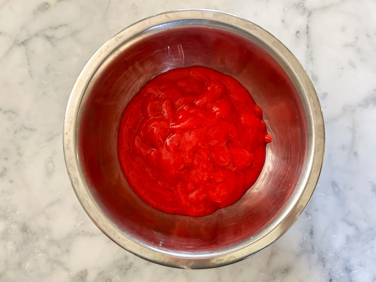 A bowl of raspberry puree