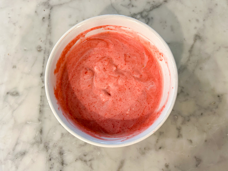Raspberry sherbet base in a small bowl