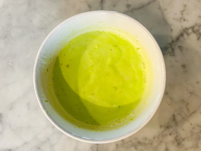 Lime green sherbet base in a small bowl