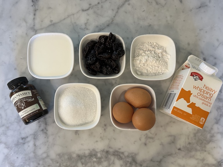 Clafoutis ingredients arranged on a marble surface