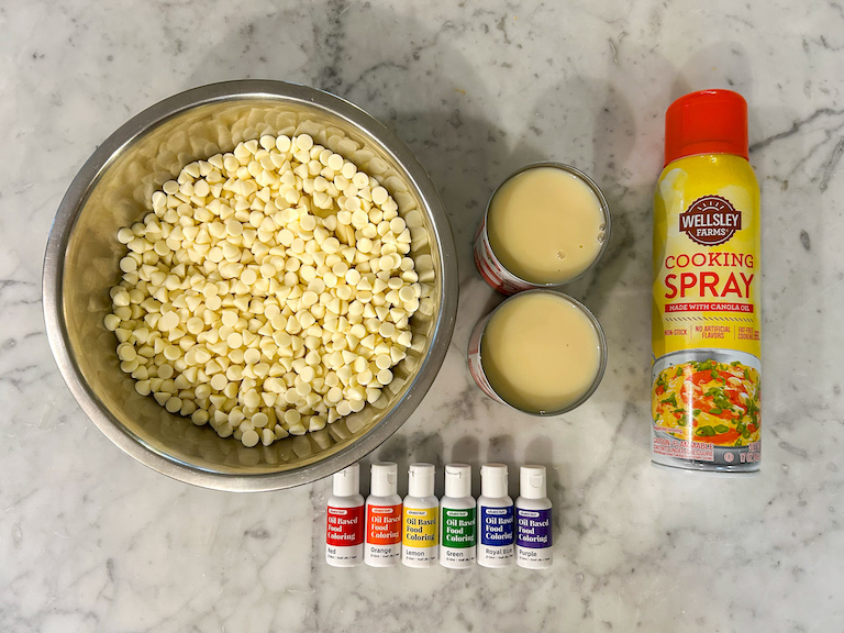 Rainbow fudge ingredients arranged on a marble surface