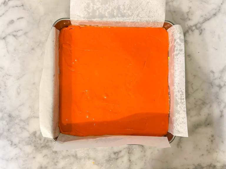 Orange fudge in a square tin