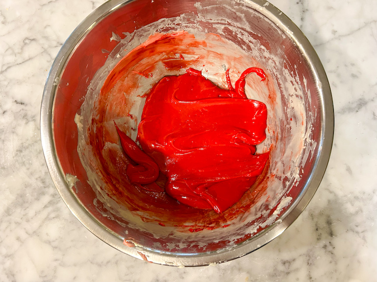Melted red chocolate in a bowl