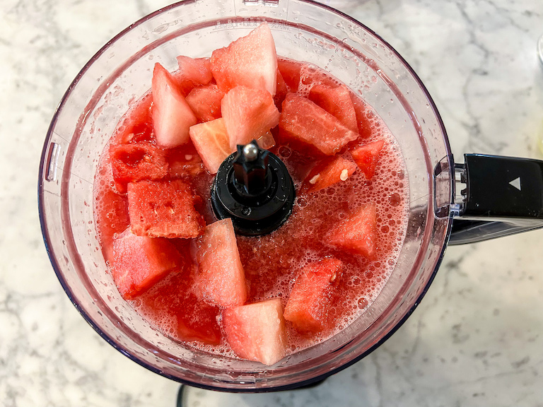 Puréeing watermelon in a food processor
