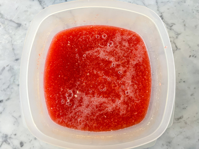 Watermelon purée in a plastic container