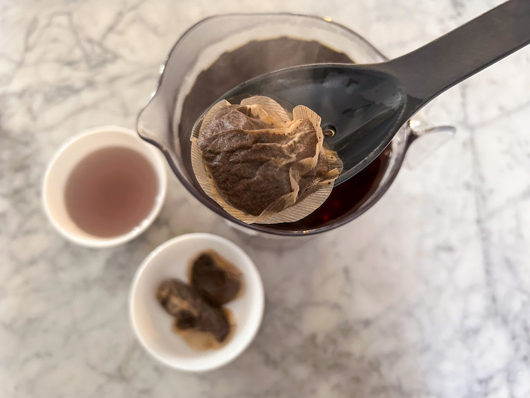 Removing tea bags with a slotted spoon