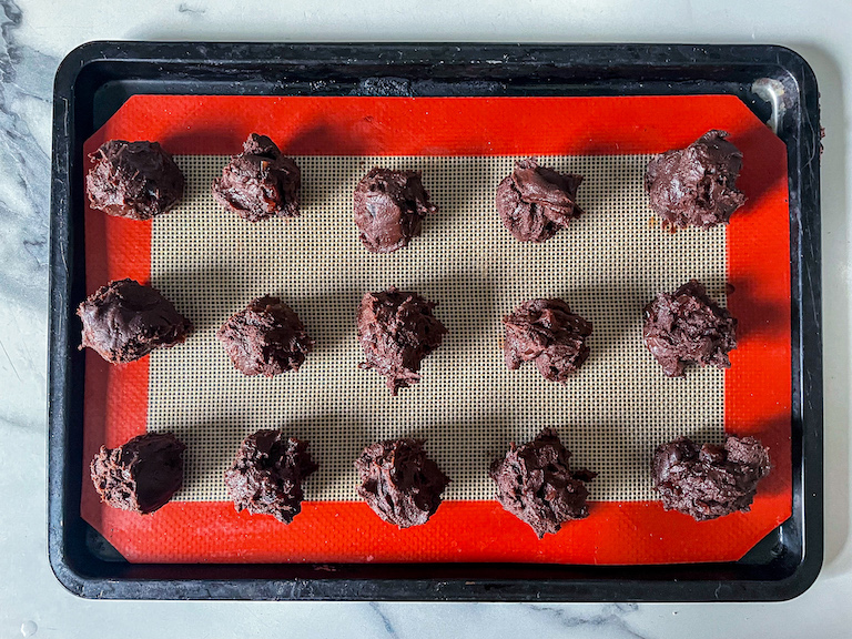 Scoops of chocolate ganache arranged on a small tray