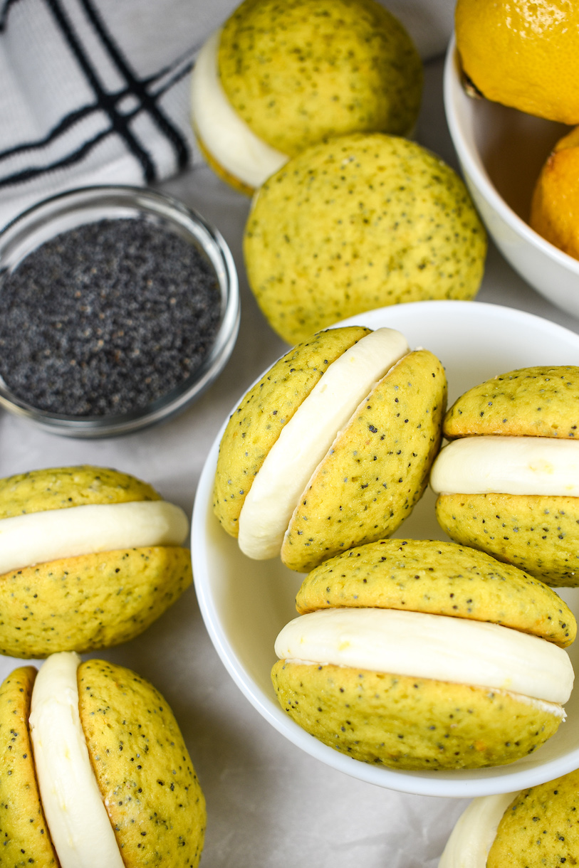 Looking down at a bowl of lemon poppy seed whoopie pies