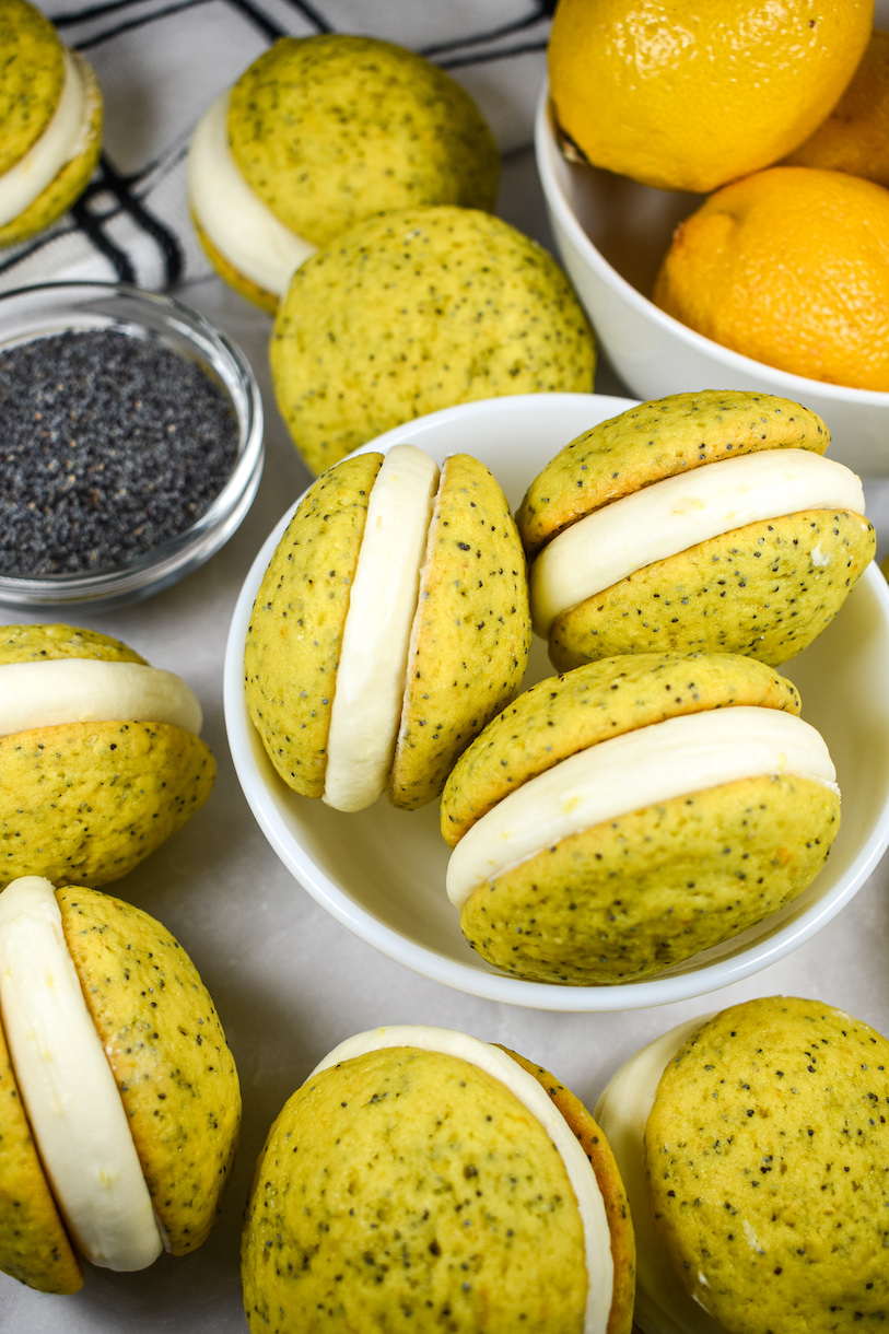 a bowl of lemon poppyseed whoopie pies