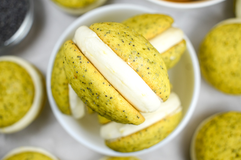 Looking down at a lemon poppyseed whoopie pie filled with lemon buttercream