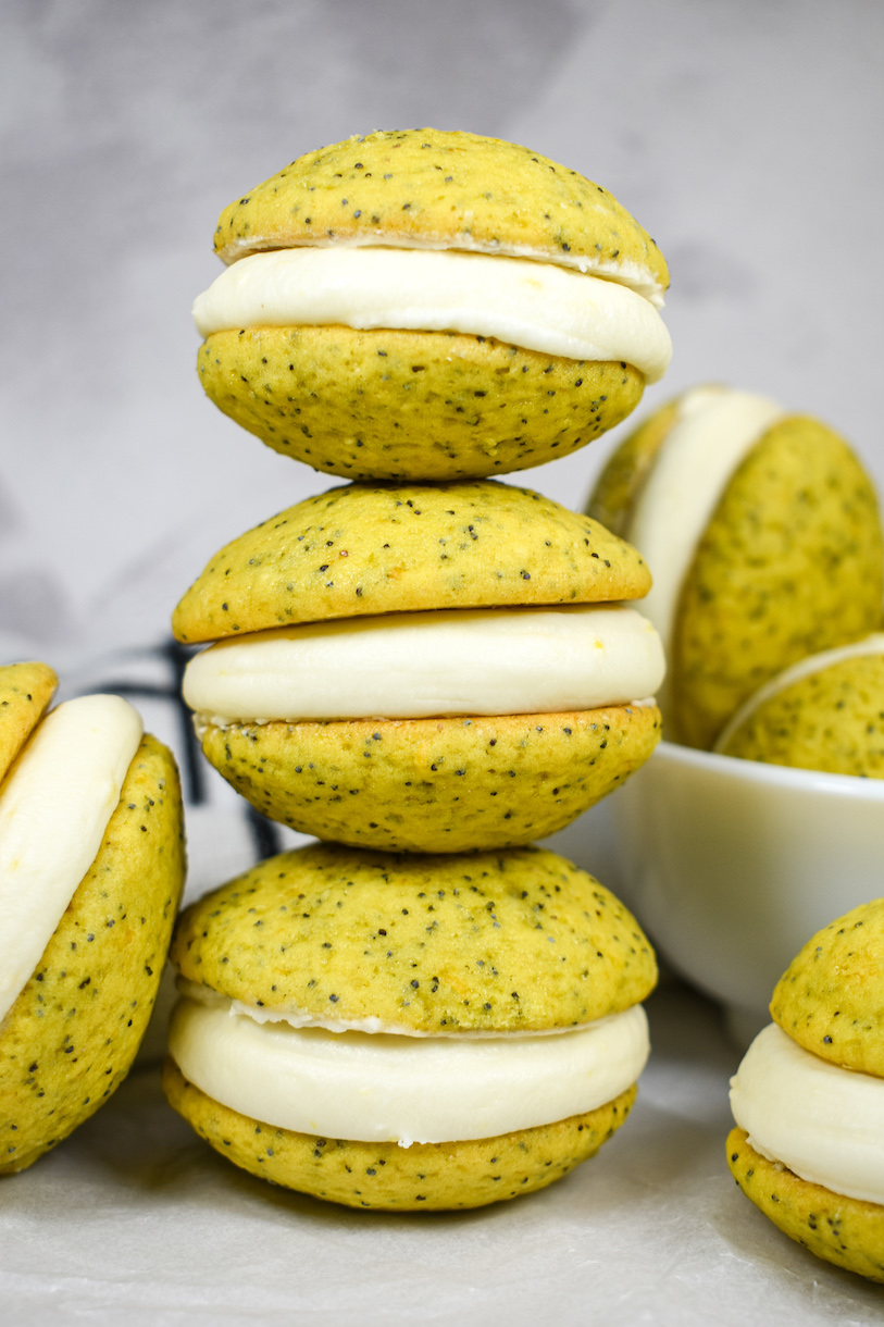 A stack of three lemon poppy seed whoopie pies