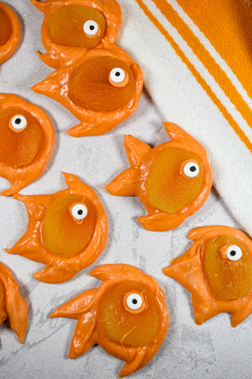 Orange chocolate goldfish decorated with dried apricots and candy eyeballs