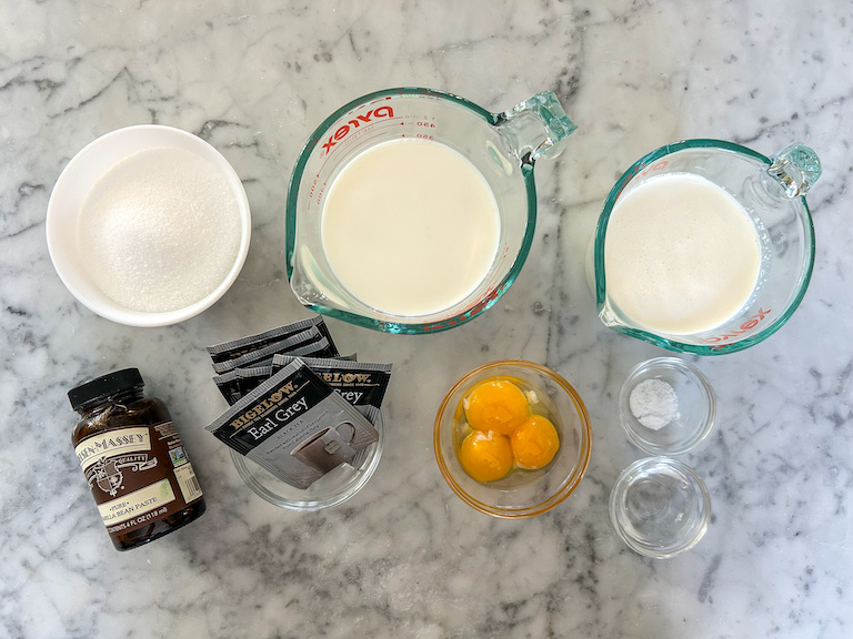 Earl Grey ice cream recipe ingredients arranged on a marble surface