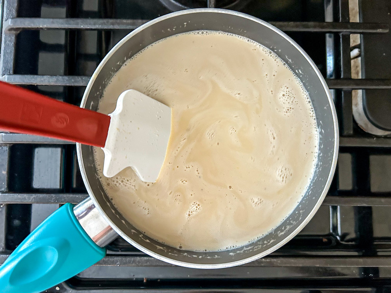 Earl Grey ice cream base cooking in a pan on the stovetop