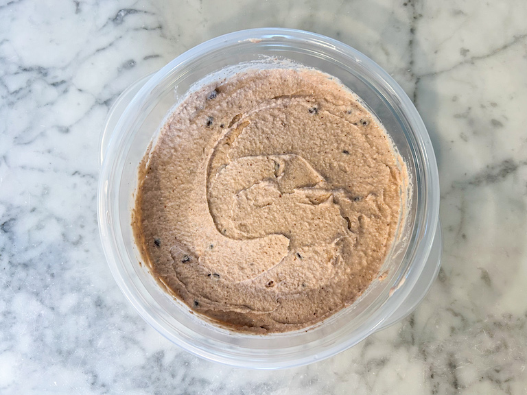 Chocolate and cherry ice cream in a plastic container