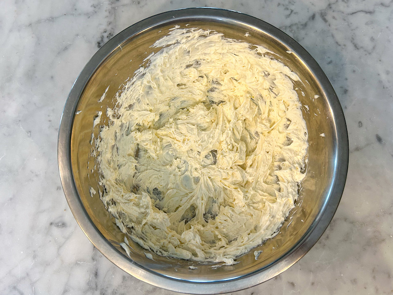 whipped cream cheese in a mixing bowl