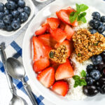 A patriotic smoothie bowl with berries and cherries