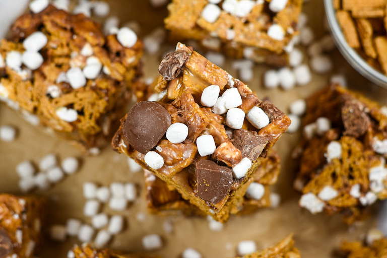 S'mores Golden Graham bars arranged on a sheet of parchment