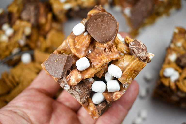 Hand holding a s'mores Golden Graham bar