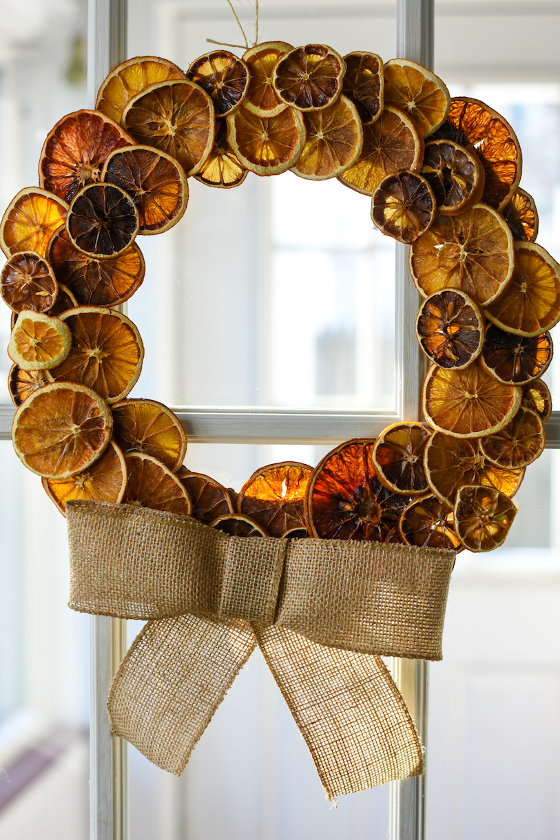 Citrus wreath hanging in a window