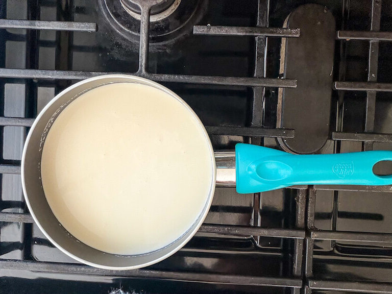 Milk, cream, and sugar in a small saucepan on the stovetop