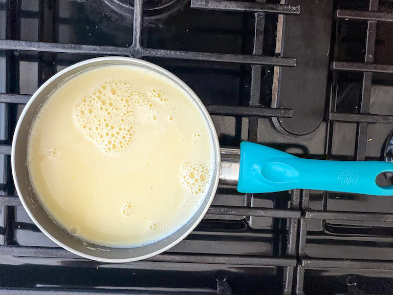 Ice cream base cooking in a pan on the stovetop