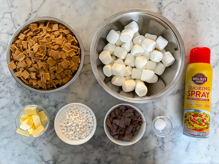 S'mores treat ingredients arranged on a marble surface