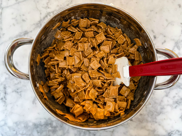 Cereal and marshmallow in a pot with a spatula