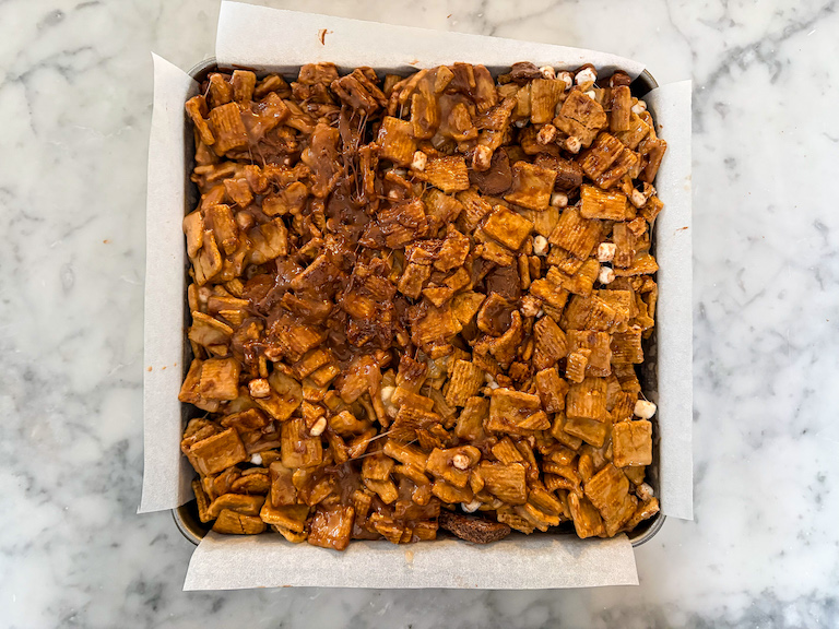 Cereal mixture pressed into a square parchment lined tin