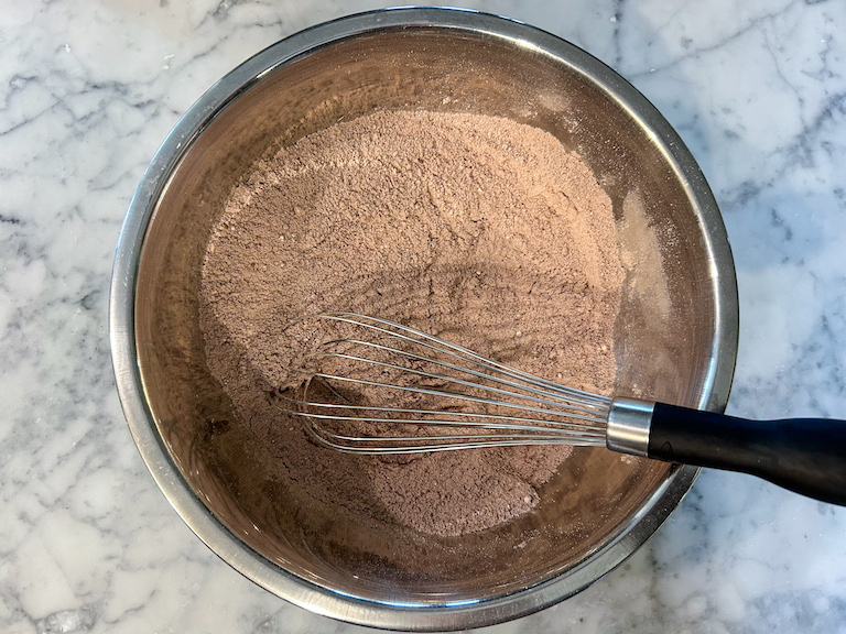 Dry ingredients in a bowl with a whisk