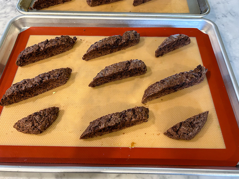 Chocolate chocolate biscotti slices on a tray