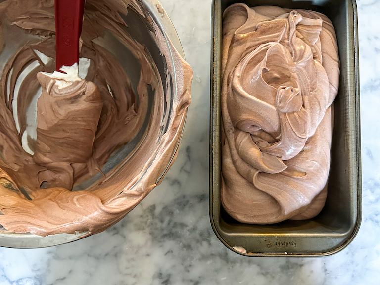 Scooping no churn chocolate ice cream into a loaf pan