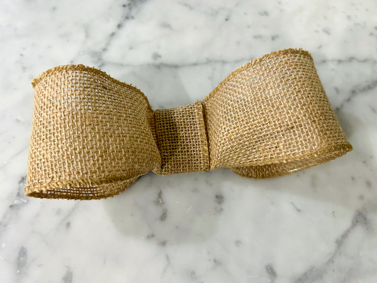 A burlap ribbon bow