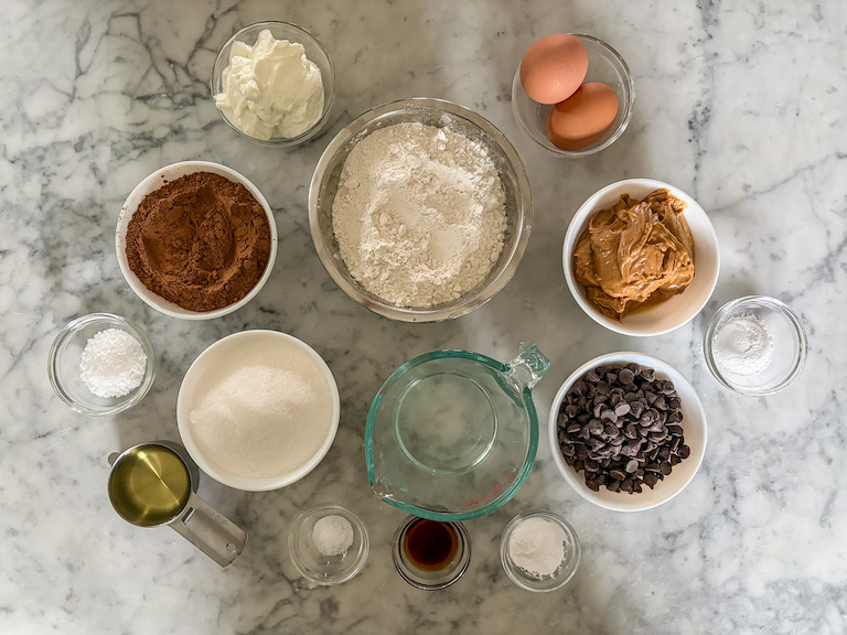 Ingredients for making chocolate peanut butter stuffed muffins