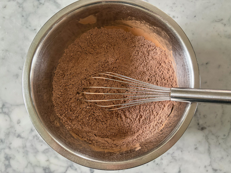 Dry ingredients in a bowl with a whisk