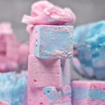 Stack of three cotton candy marshmallows with pink spun sugar on top