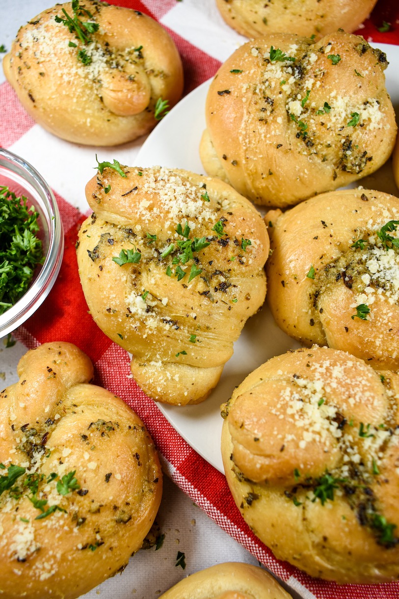 Garlic knots arranged on a red and white checkered towel