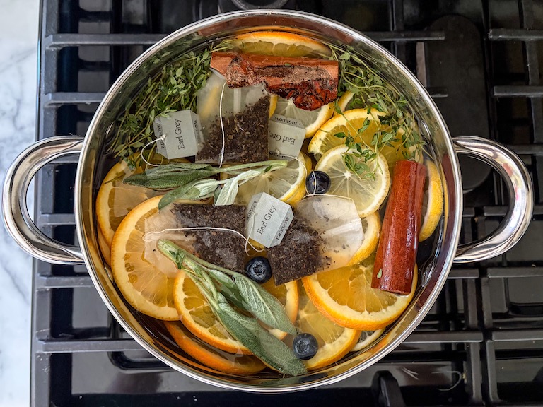 A simmer pot sitting on the stovetop