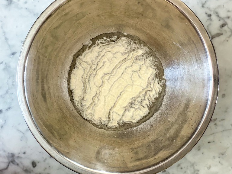 Gelatin and water in a bowl