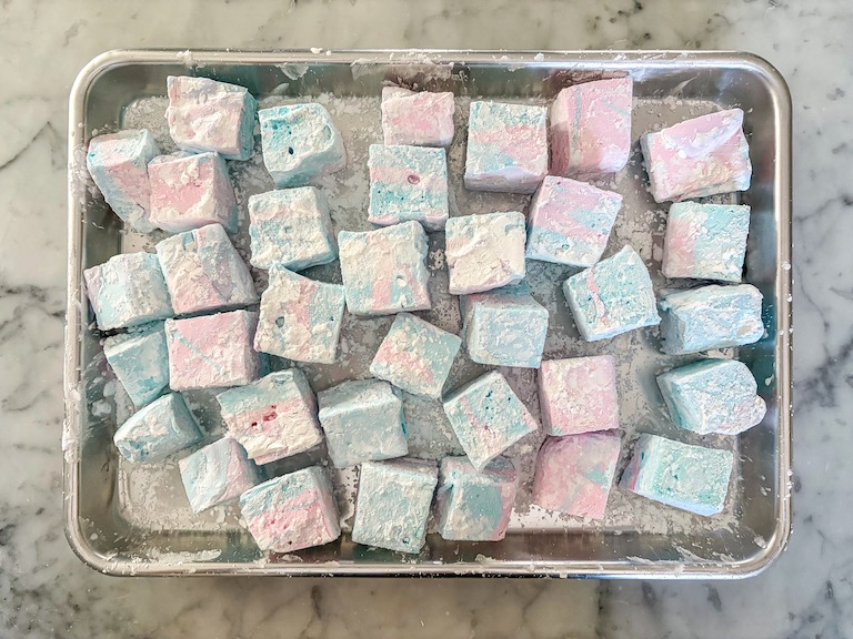 A metal tray of cotton candy marshmallows