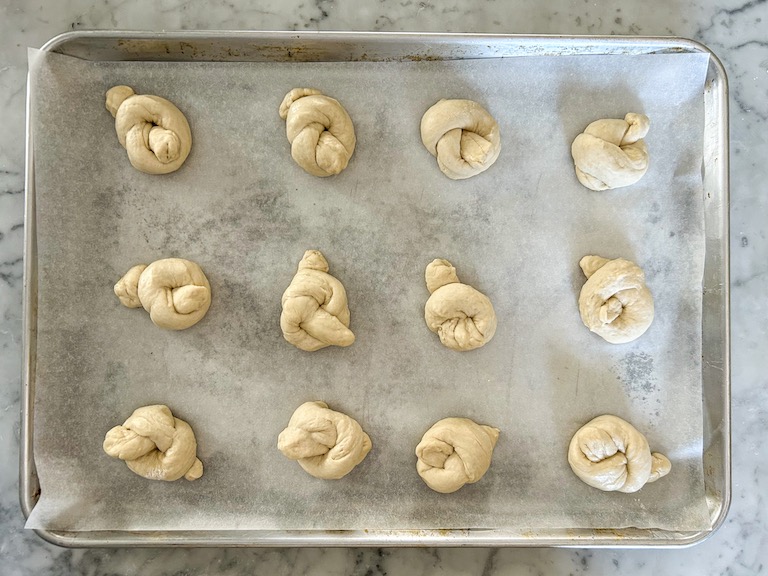 A tray of garlic knots before baking