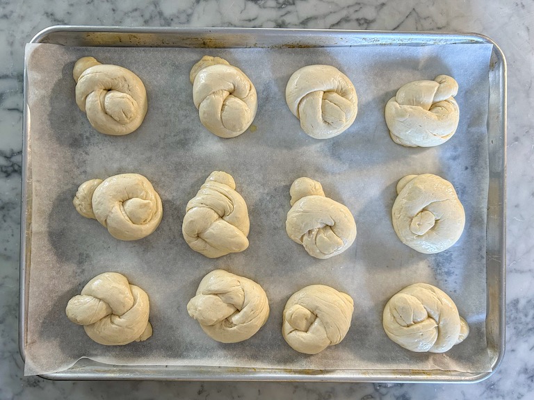 a tray of garlic knots before baking