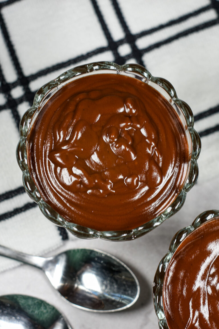 glass dishes of hot fudge sauce with a spoon