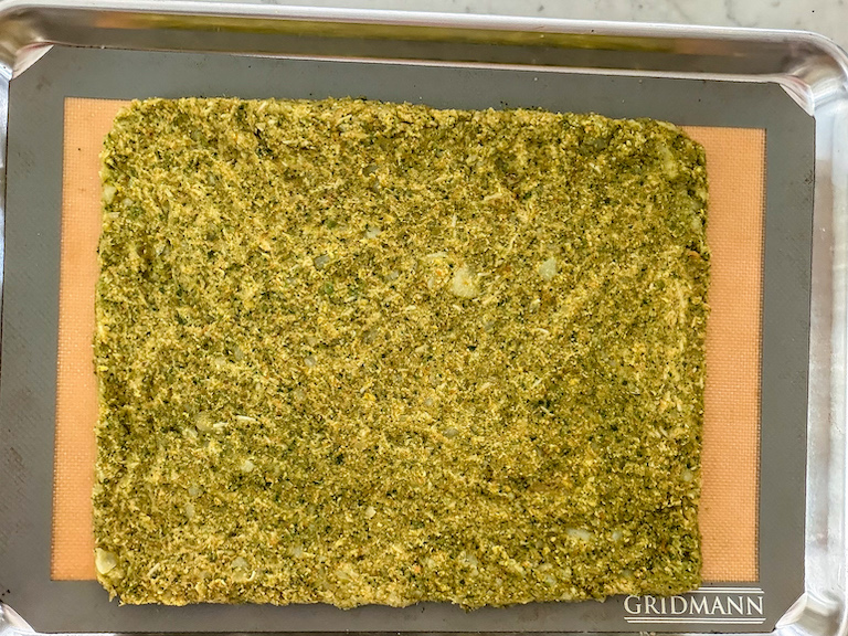 vegetable mash mixture flattened on a tray