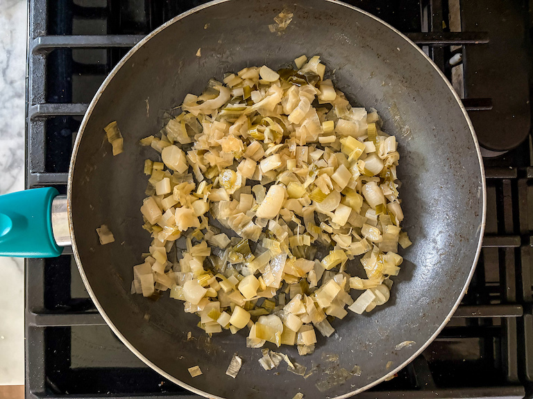 Leeks caramelizing in a pan